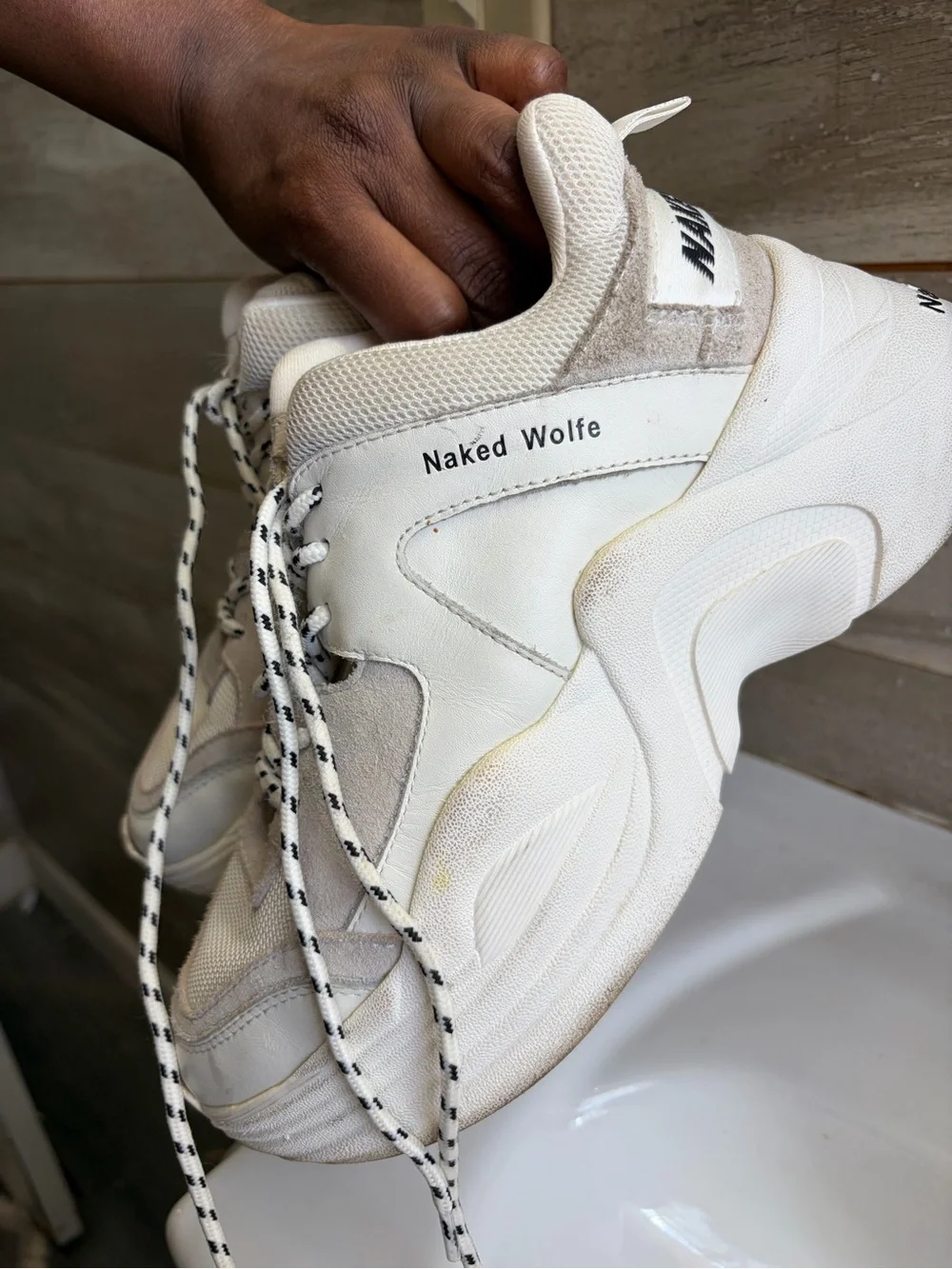 Naked Wolfe Track flatform sneakers w/ a chunky platform sole &- brand lettering
